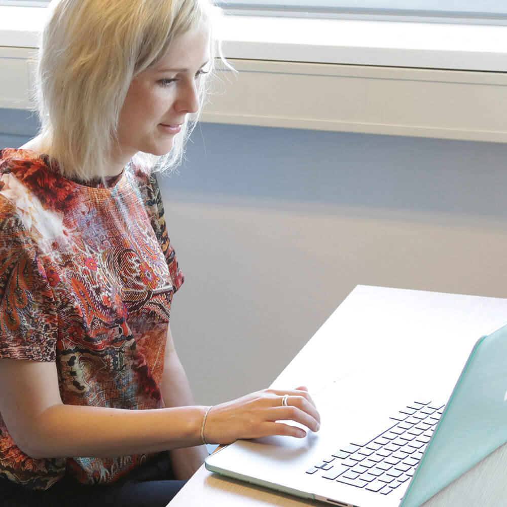 Person sitting by window working on Pathways